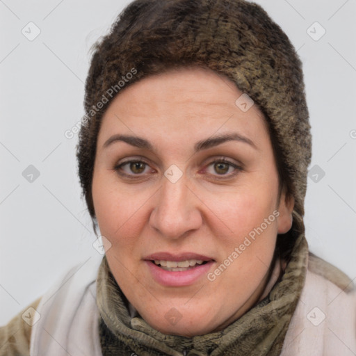 Joyful white adult female with short  brown hair and brown eyes