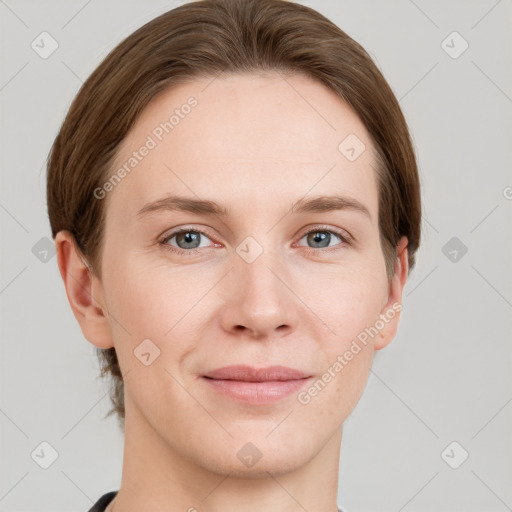 Joyful white young-adult female with short  brown hair and grey eyes