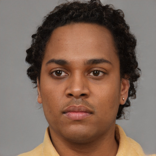 Neutral black young-adult male with short  brown hair and brown eyes