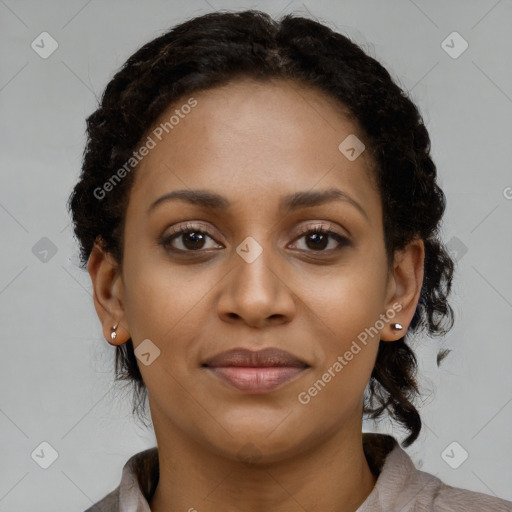 Joyful black young-adult female with short  brown hair and brown eyes