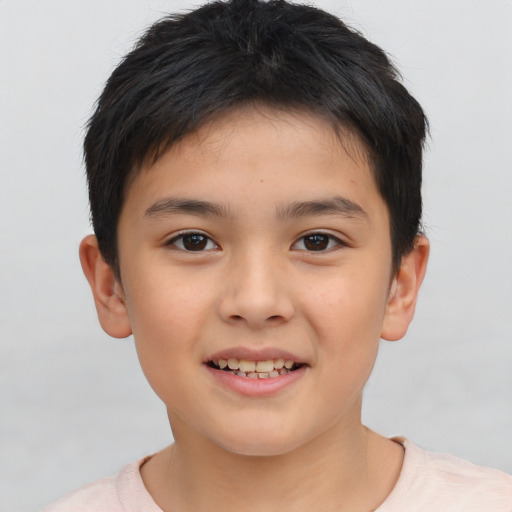 Joyful asian child female with short  brown hair and brown eyes