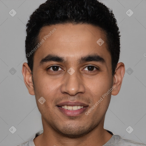 Joyful latino young-adult male with short  black hair and brown eyes
