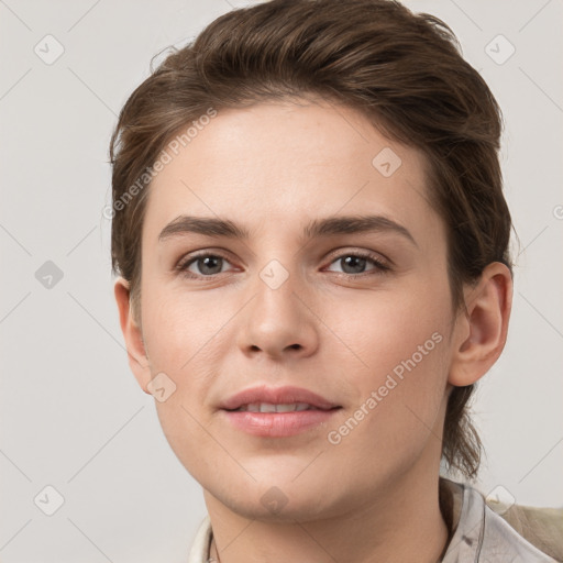 Joyful white young-adult female with short  brown hair and grey eyes