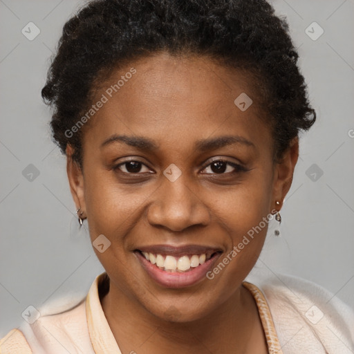 Joyful black young-adult female with short  brown hair and brown eyes