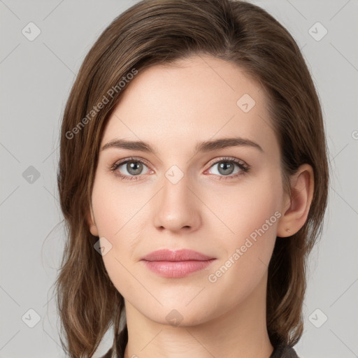 Joyful white young-adult female with medium  brown hair and green eyes