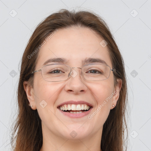 Joyful white adult female with long  brown hair and grey eyes