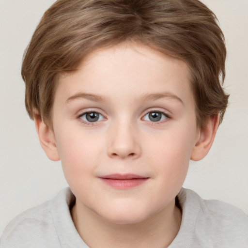 Joyful white child female with short  brown hair and grey eyes