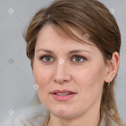 Joyful white adult female with medium  brown hair and grey eyes