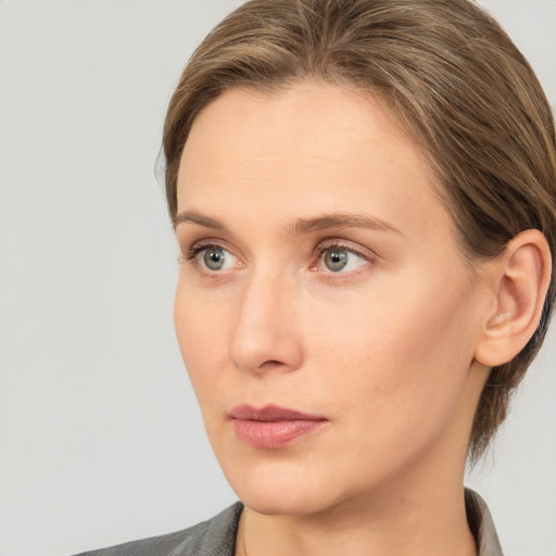 Neutral white young-adult female with medium  brown hair and grey eyes