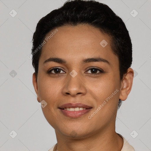 Joyful latino young-adult female with short  black hair and brown eyes