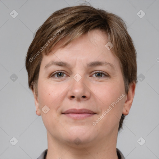 Joyful white young-adult female with short  brown hair and grey eyes