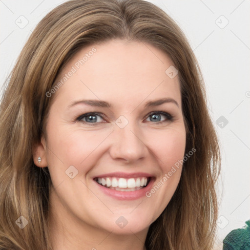 Joyful white young-adult female with medium  brown hair and green eyes