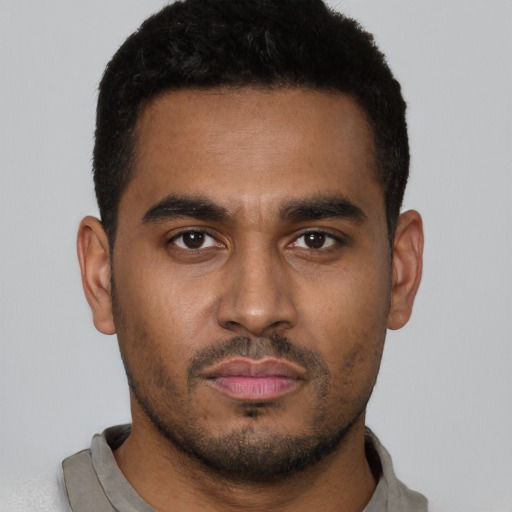 Neutral black young-adult male with short  black hair and brown eyes