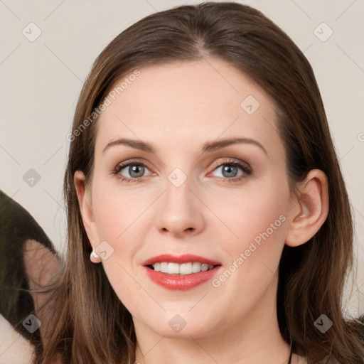 Joyful white young-adult female with long  brown hair and grey eyes