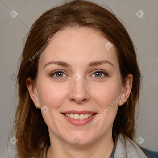 Joyful white adult female with medium  brown hair and grey eyes