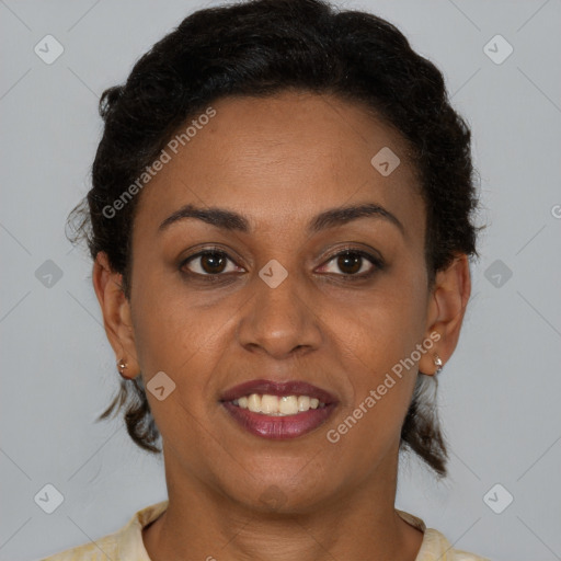 Joyful black young-adult female with short  brown hair and brown eyes