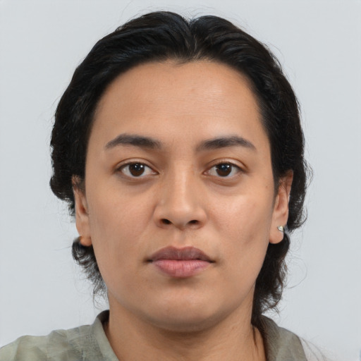 Neutral latino young-adult female with medium  brown hair and brown eyes