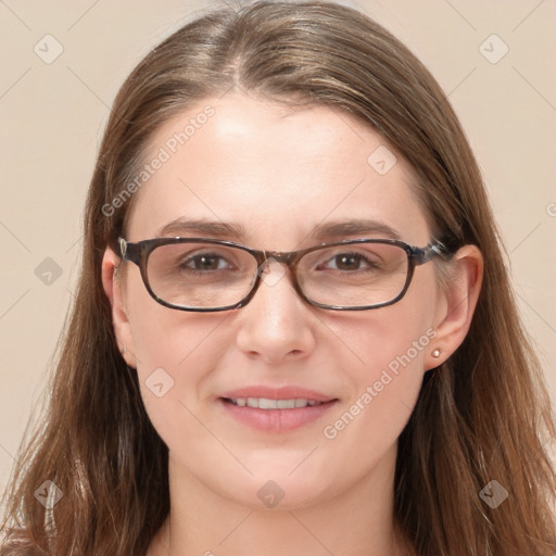 Joyful white young-adult female with long  brown hair and blue eyes