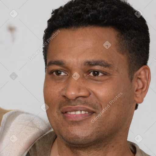 Joyful latino young-adult male with short  black hair and brown eyes