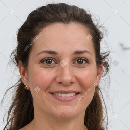 Joyful white adult female with long  brown hair and brown eyes