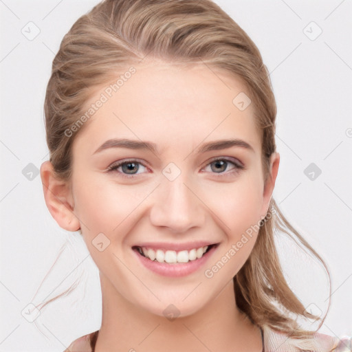 Joyful white young-adult female with medium  brown hair and blue eyes