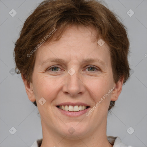 Joyful white adult female with short  brown hair and grey eyes