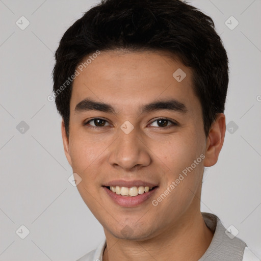 Joyful white young-adult male with short  black hair and brown eyes