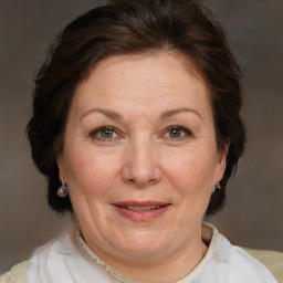 Joyful white adult female with short  brown hair and brown eyes