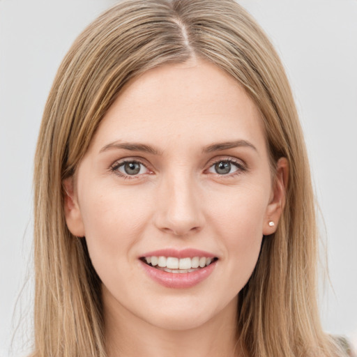 Joyful white young-adult female with long  brown hair and grey eyes