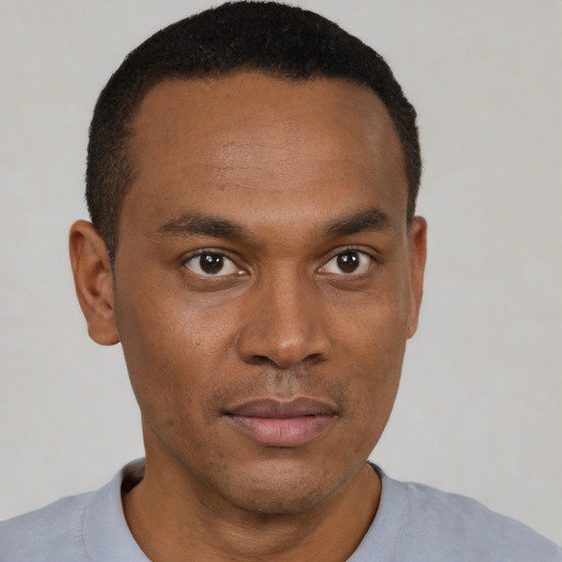 Neutral black young-adult male with short  black hair and brown eyes