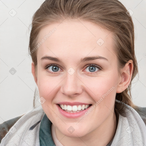 Joyful white young-adult female with medium  brown hair and blue eyes