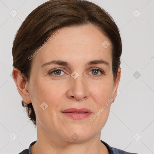 Joyful white adult female with short  brown hair and grey eyes