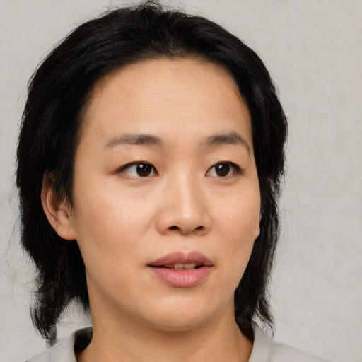 Neutral asian young-adult female with medium  black hair and brown eyes