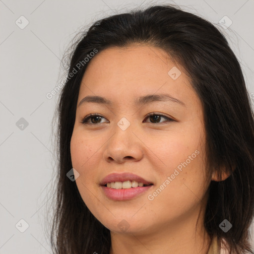 Joyful asian young-adult female with long  brown hair and brown eyes