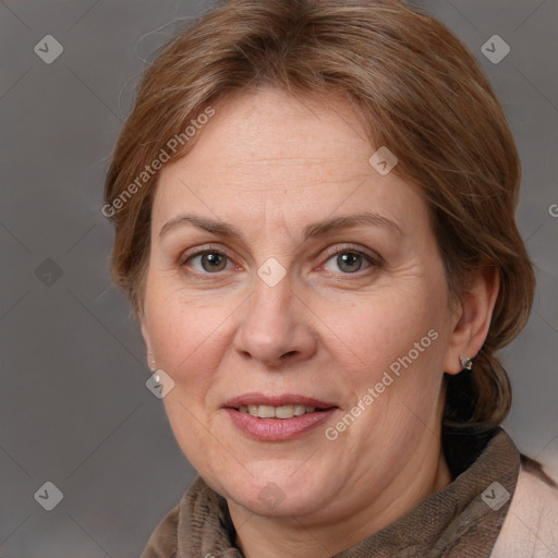 Joyful white adult female with medium  brown hair and grey eyes