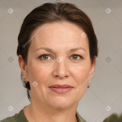 Joyful white adult female with medium  brown hair and grey eyes