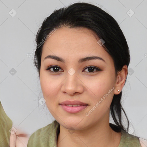 Joyful latino young-adult female with medium  black hair and brown eyes