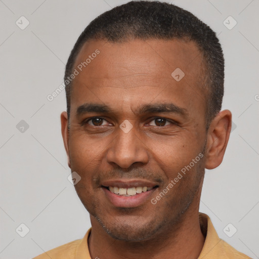 Joyful latino young-adult male with short  brown hair and brown eyes
