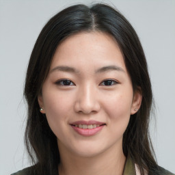 Joyful asian young-adult female with long  brown hair and brown eyes