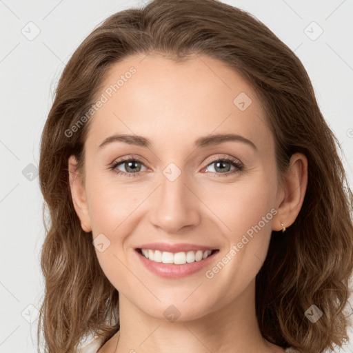 Joyful white young-adult female with long  brown hair and green eyes