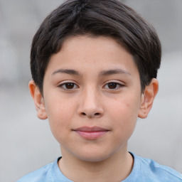 Joyful white child male with short  brown hair and brown eyes