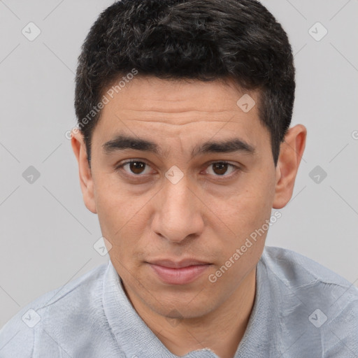 Joyful white adult male with short  black hair and brown eyes