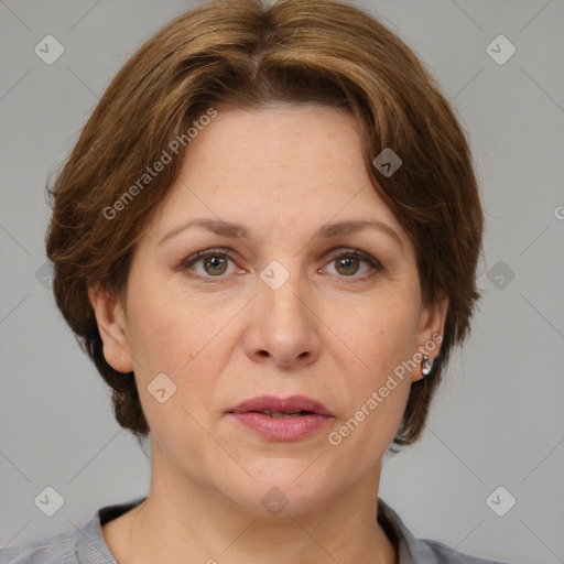 Joyful white adult female with medium  brown hair and grey eyes