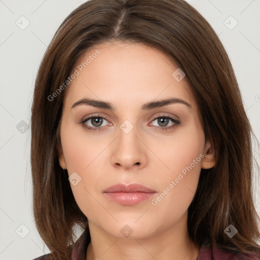 Neutral white young-adult female with long  brown hair and brown eyes