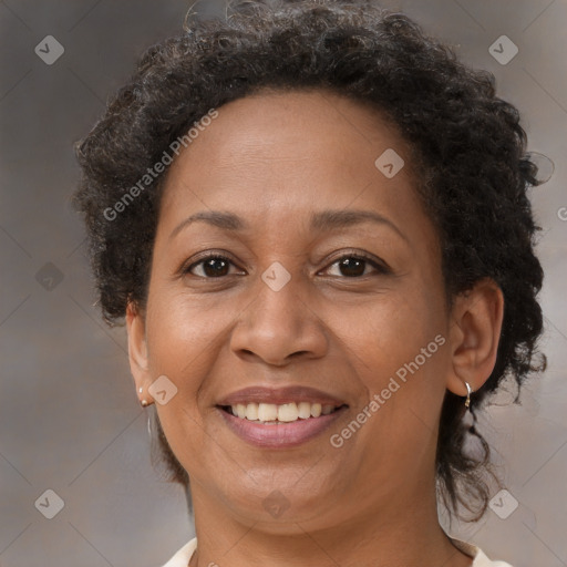 Joyful black adult female with short  brown hair and brown eyes