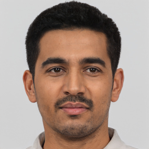 Neutral latino young-adult male with short  black hair and brown eyes
