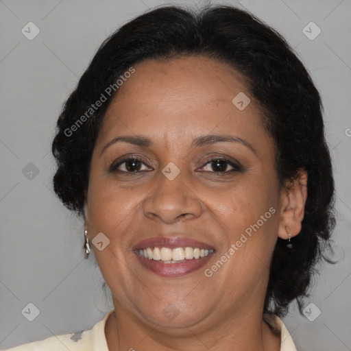 Joyful black adult female with medium  brown hair and brown eyes