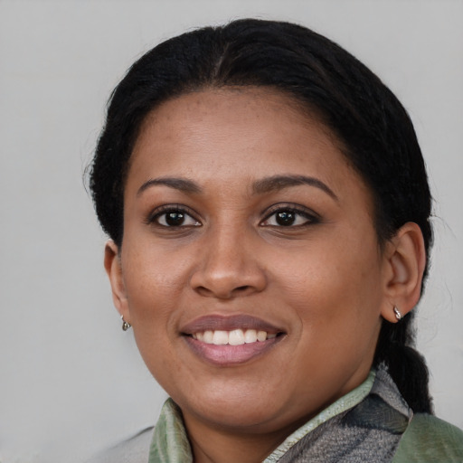 Joyful asian young-adult female with medium  black hair and brown eyes