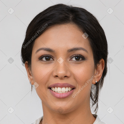 Joyful latino young-adult female with medium  brown hair and brown eyes