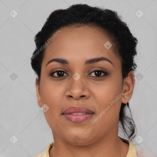 Joyful black young-adult female with short  brown hair and brown eyes